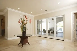 Modern tile open dining area with sliding doors.