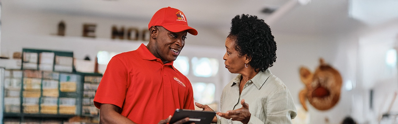 My handyman employee speaking with a client.