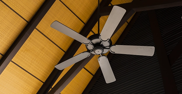 A picture of a ceiling fan installed at the apex of a vaulted ceiling.