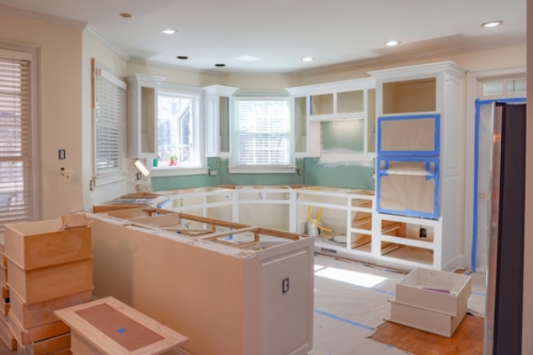 Prepping for new custom cabinet installation.