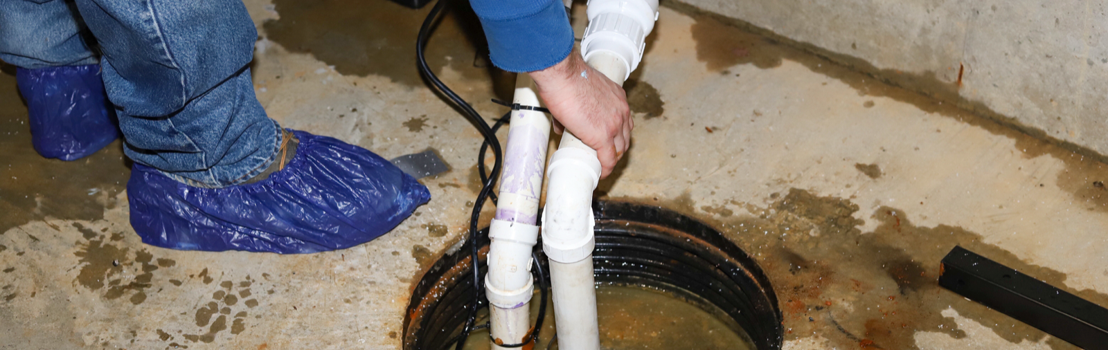 A sump pump being installed