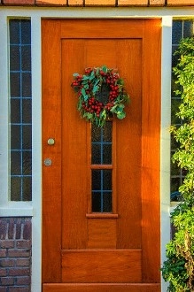 orange wood door with wreath